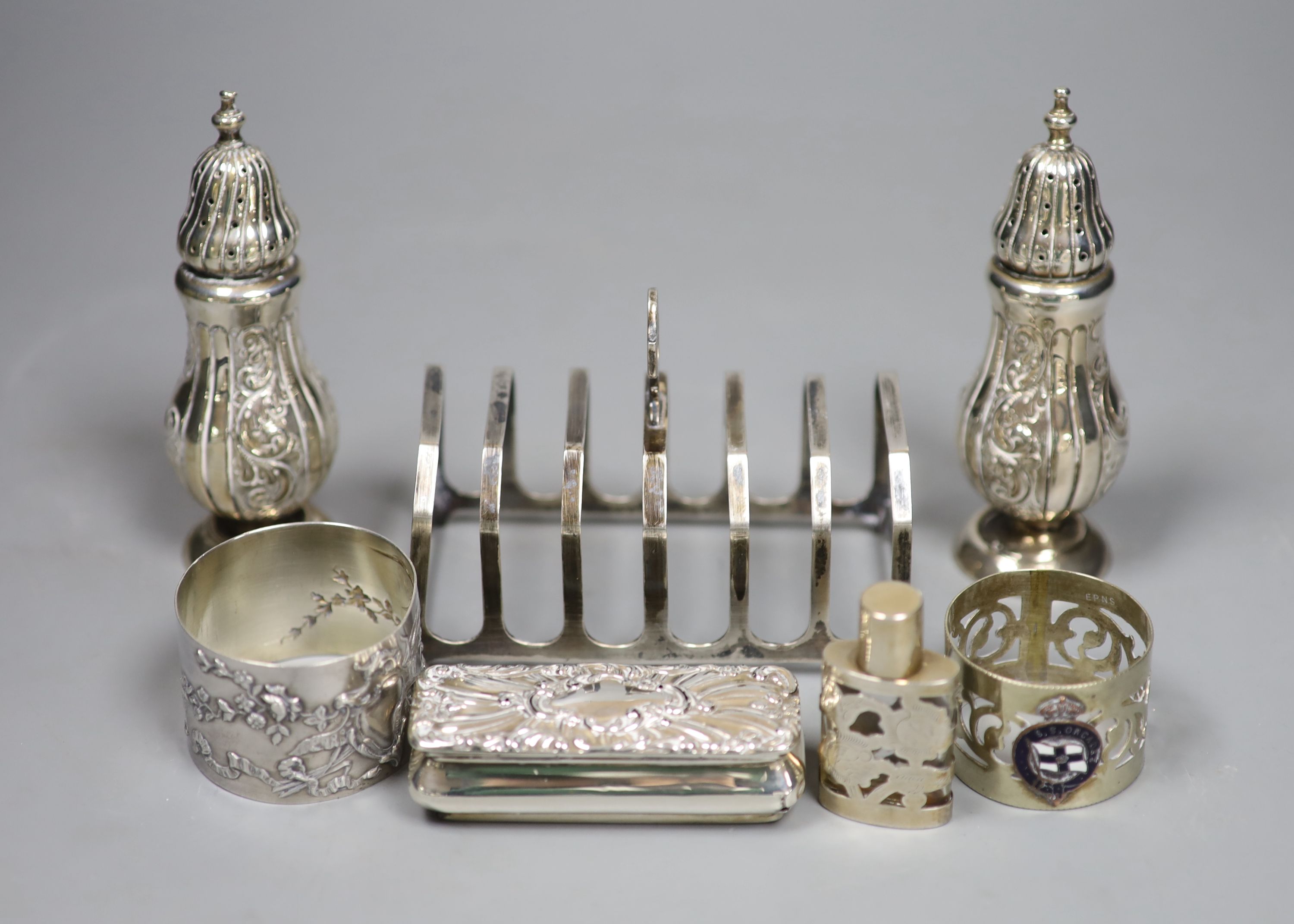 A pair of late Victorian silver pepperettes, Birmingham, 1898, 11.9cm(a.f.) & other items.